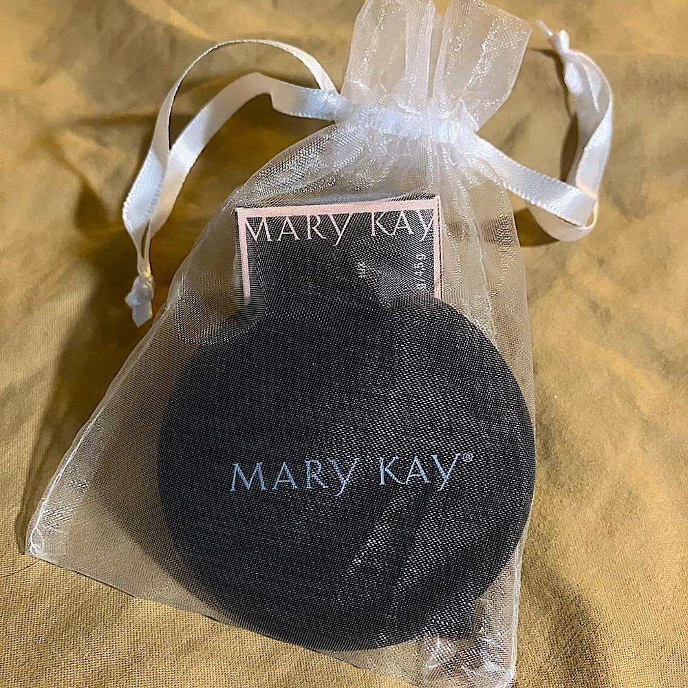 Mary Kay gel eyeliner/brush and mirror in gift bag.